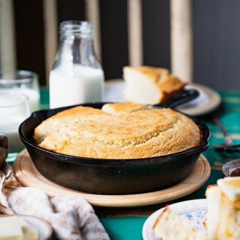Cornbread in a cast iron skillet on a table