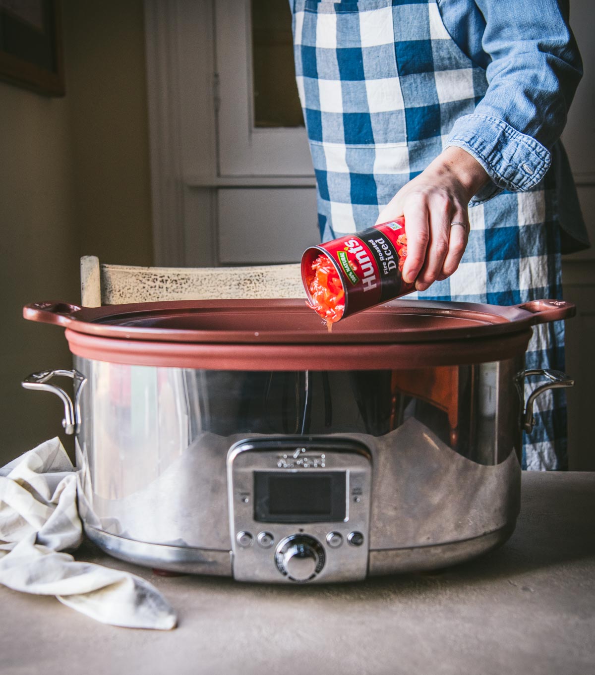 Adding fire roasted diced tomatoes to a slow cooker