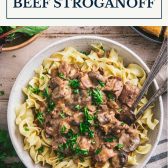 Bowl of crock pot beef stroganoff with text title box at top