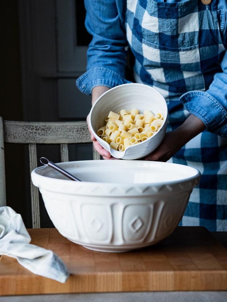Add rigatoni to a large bowl
