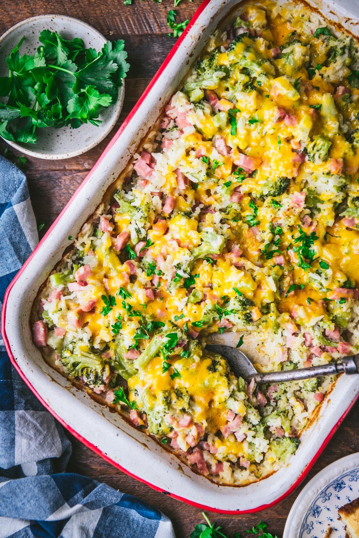 Ham and rice casserole with cheddar and broccoli in a baking dish