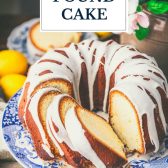 Moist lemon pound cake on a blue and white platter with text title overlay