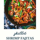 Pan of shrimp fajitas with text title at the bottom