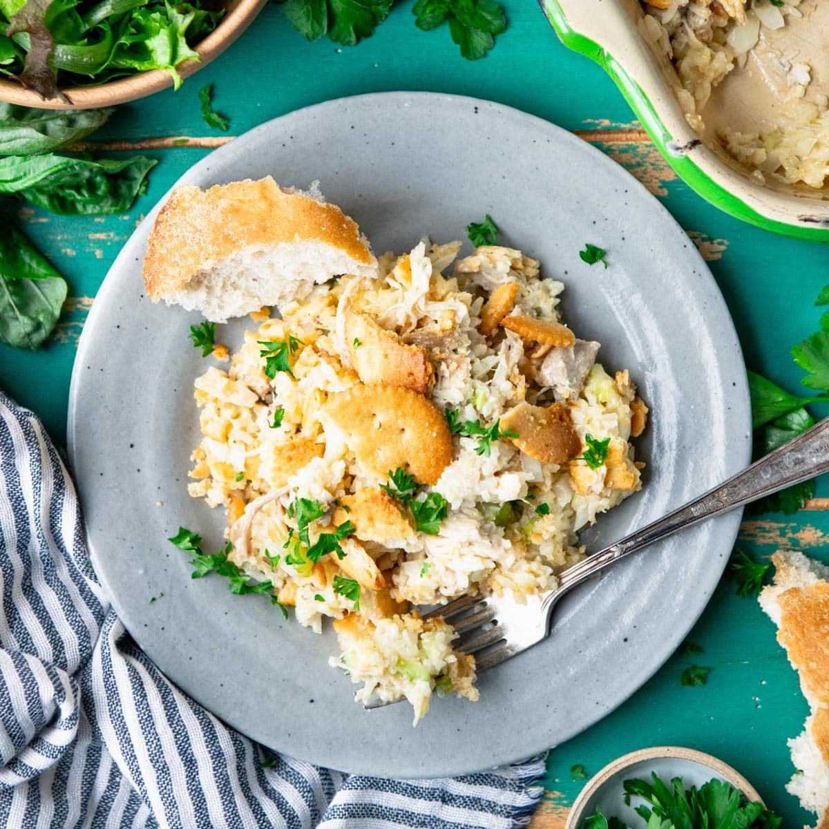 Square overhead shot of a plate of chicken and rice casserole.