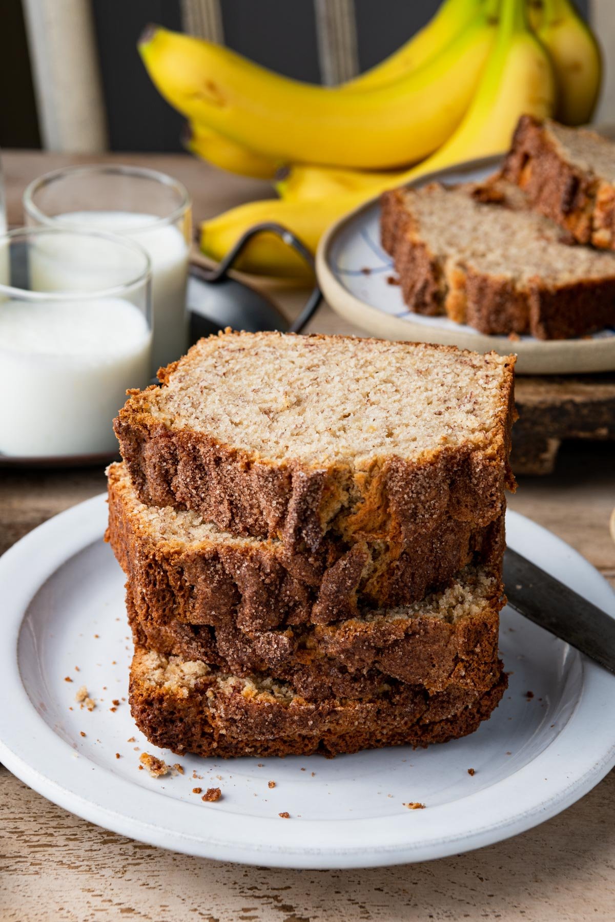 Plate of sliced buttermilk banana bread on a table