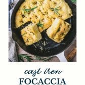 Skillet of cast iron focaccia with text title at the bottom.