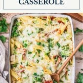 Pan of chicken alfredo casserole with text title box at top