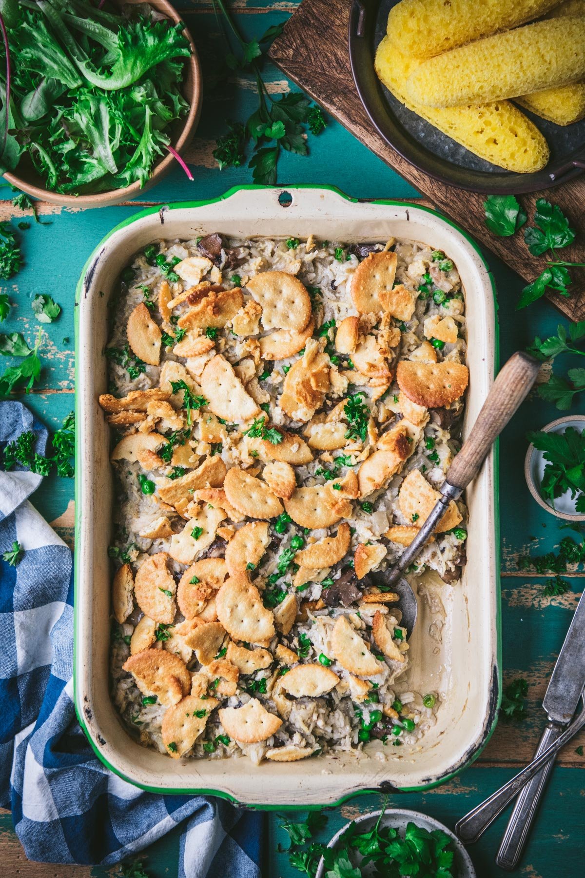 Chicken mushroom rice casserole in a vintage enamelware dish on an old wooden table.