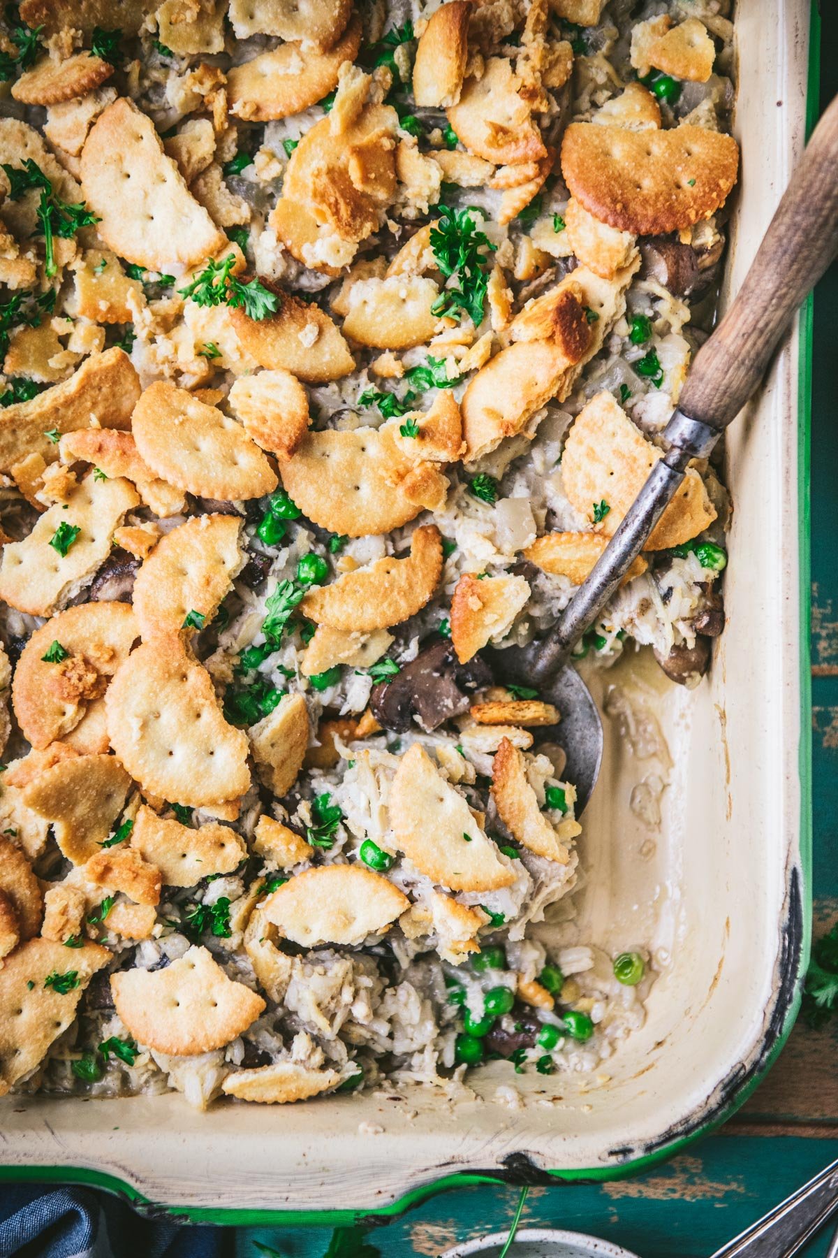 Close overhead image of serving spoon in a pan of chicken mushroom and rice casserole
