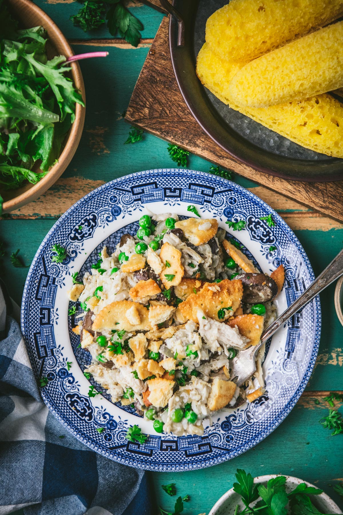 Chicken mushroom rice casserole on a blue and white plate.