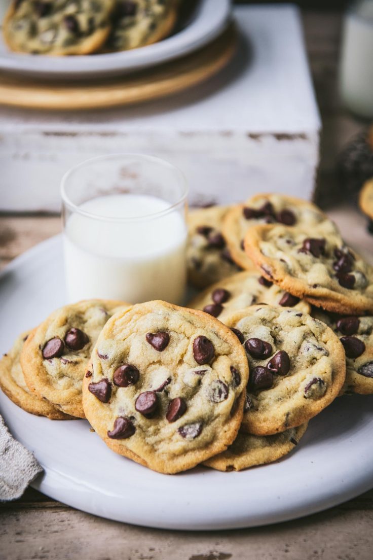 Platter of chocolate chip pudding cookies with a glass of milk