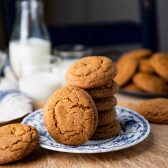 Square side shot of soft ginger molasses cookies on a blue and white plate