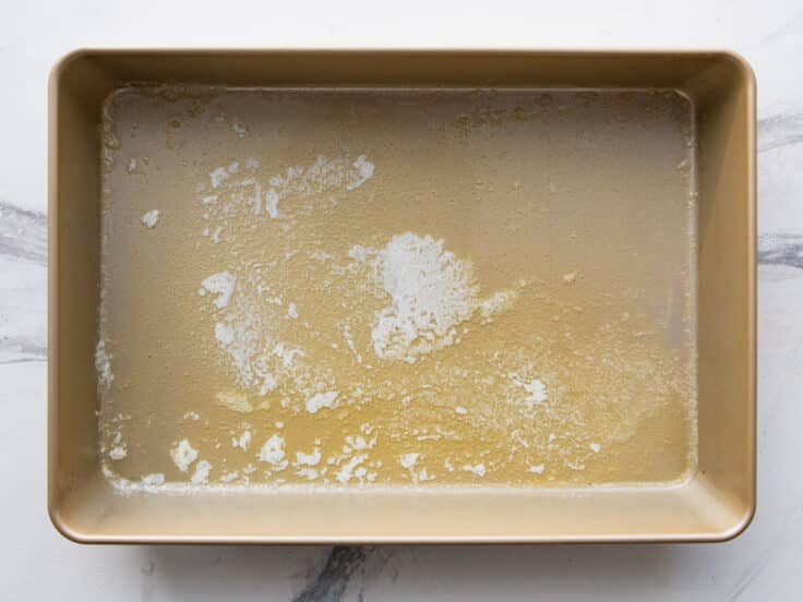 Melted butter in the pan.