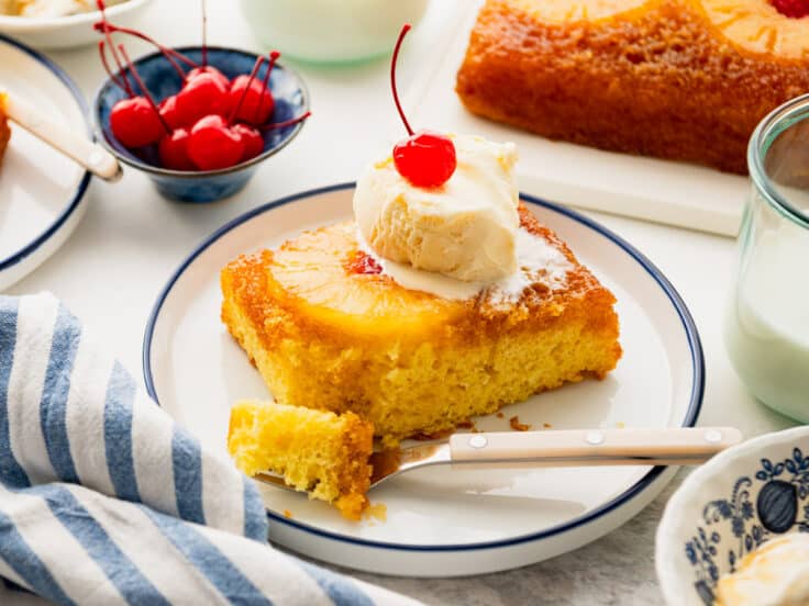 Horizontal side shot of a plate of easy pineapple upside down cake with cake mix.