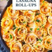 Close overhead image of a skillet of buffalo chicken lasagna roll ups with text title overlay