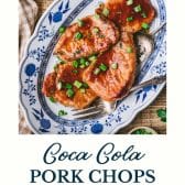 Platter of coca cola pork chops with text title at the bottom.