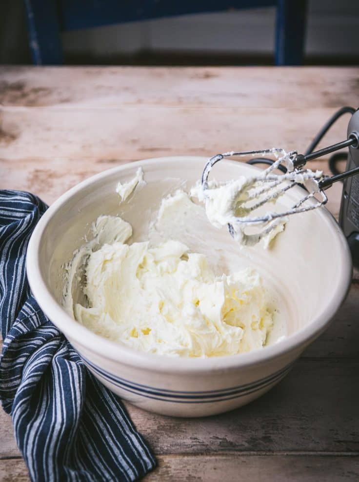 Process shot showing how to make lemon cheesecake filling for bars.