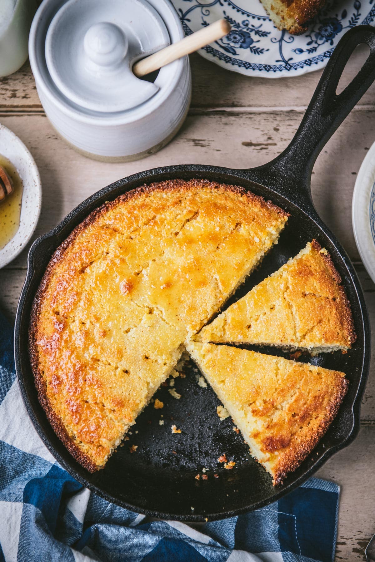Overhead image of a skillet of honey butter cornbread.