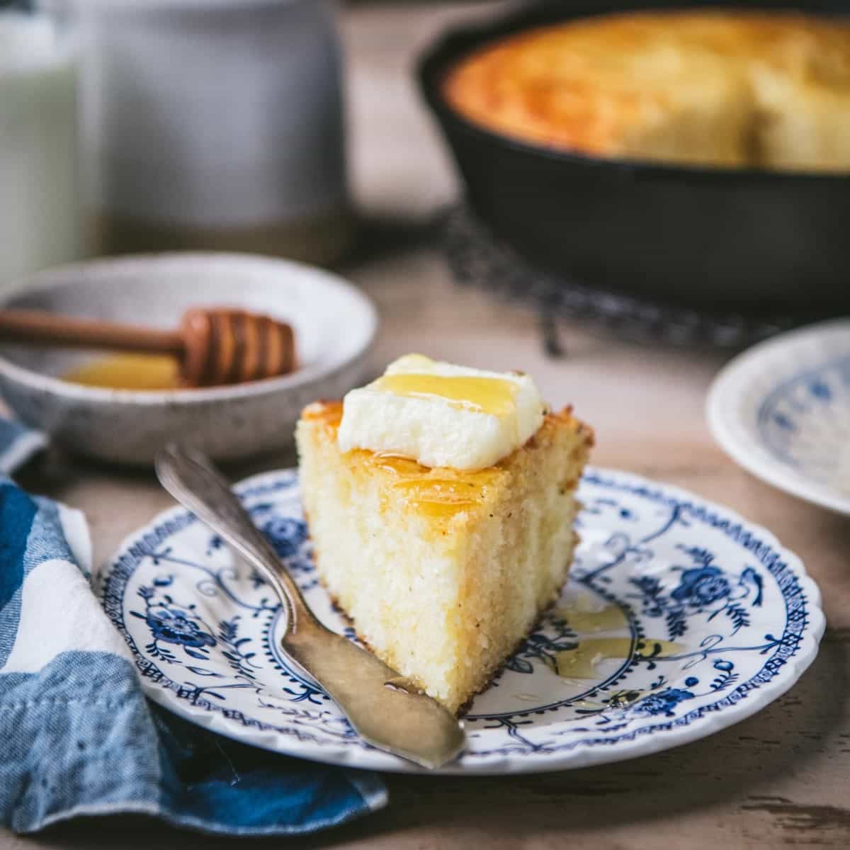 Front shot of a slice of honey butter cornbread.