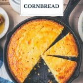 Skillet of honey butter cornbread with text title overlay.