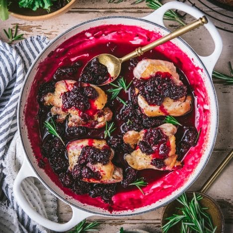 Square overhead shot of blackberry chicken in a pan.