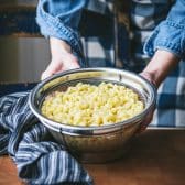 Boiled macaroni in a colander.