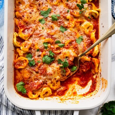 Square overhead shot of a pan of baked tortellini.