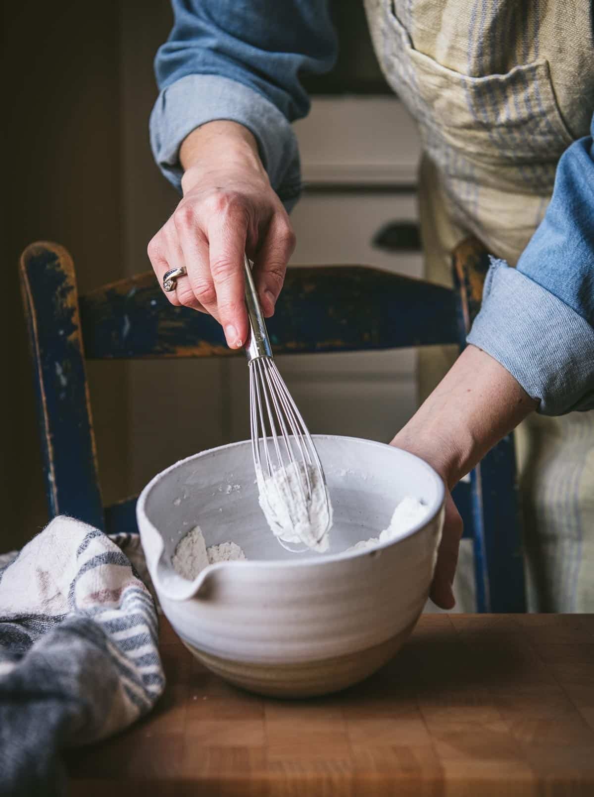 Whisking together dry ingredients in a small bowl.