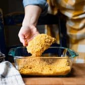Process shot showing how to make cornflake chicken.