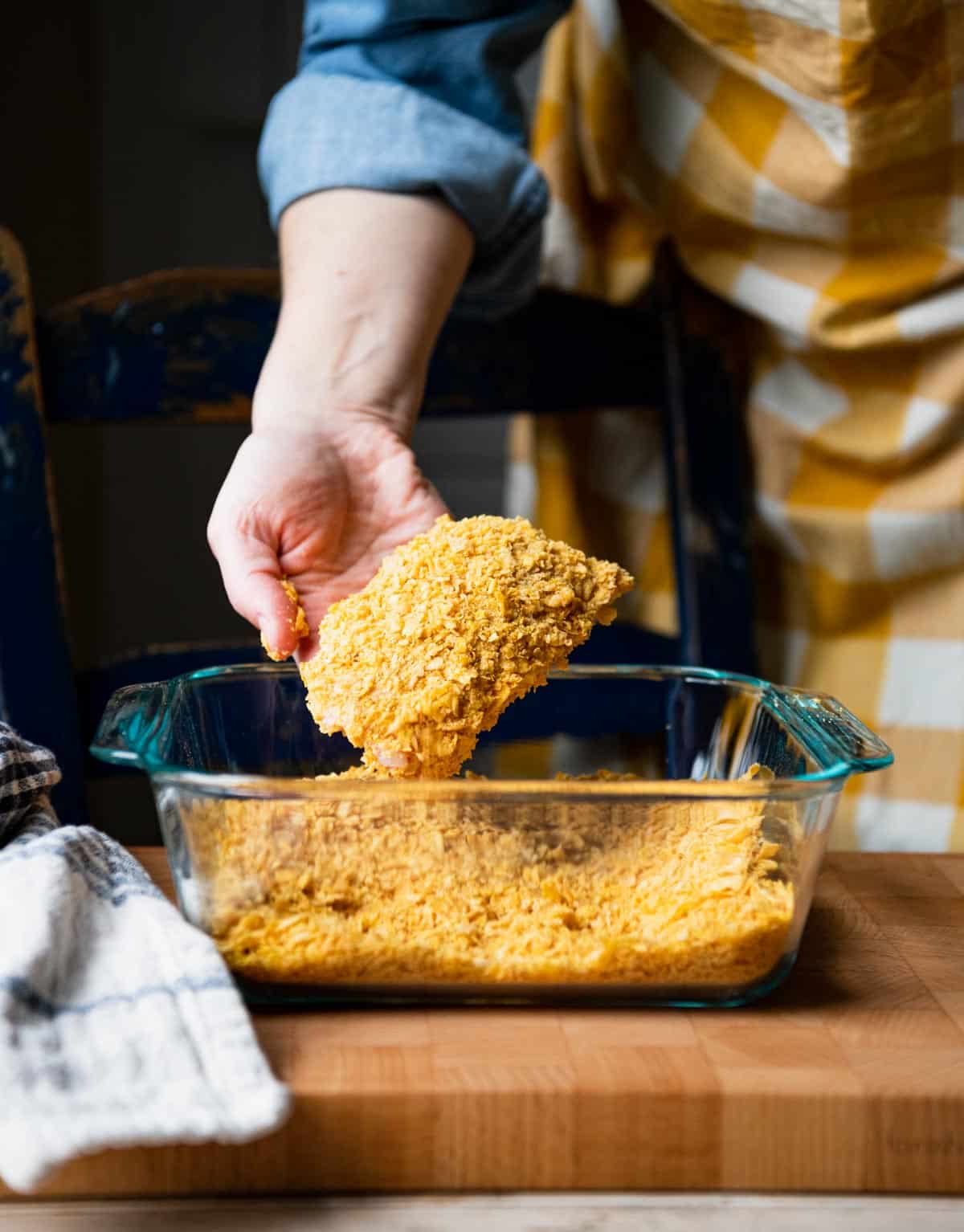 Process shot showing how to make cornflake chicken.