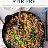 Skillet of ground beef stir fry with cabbage and text title box at top.