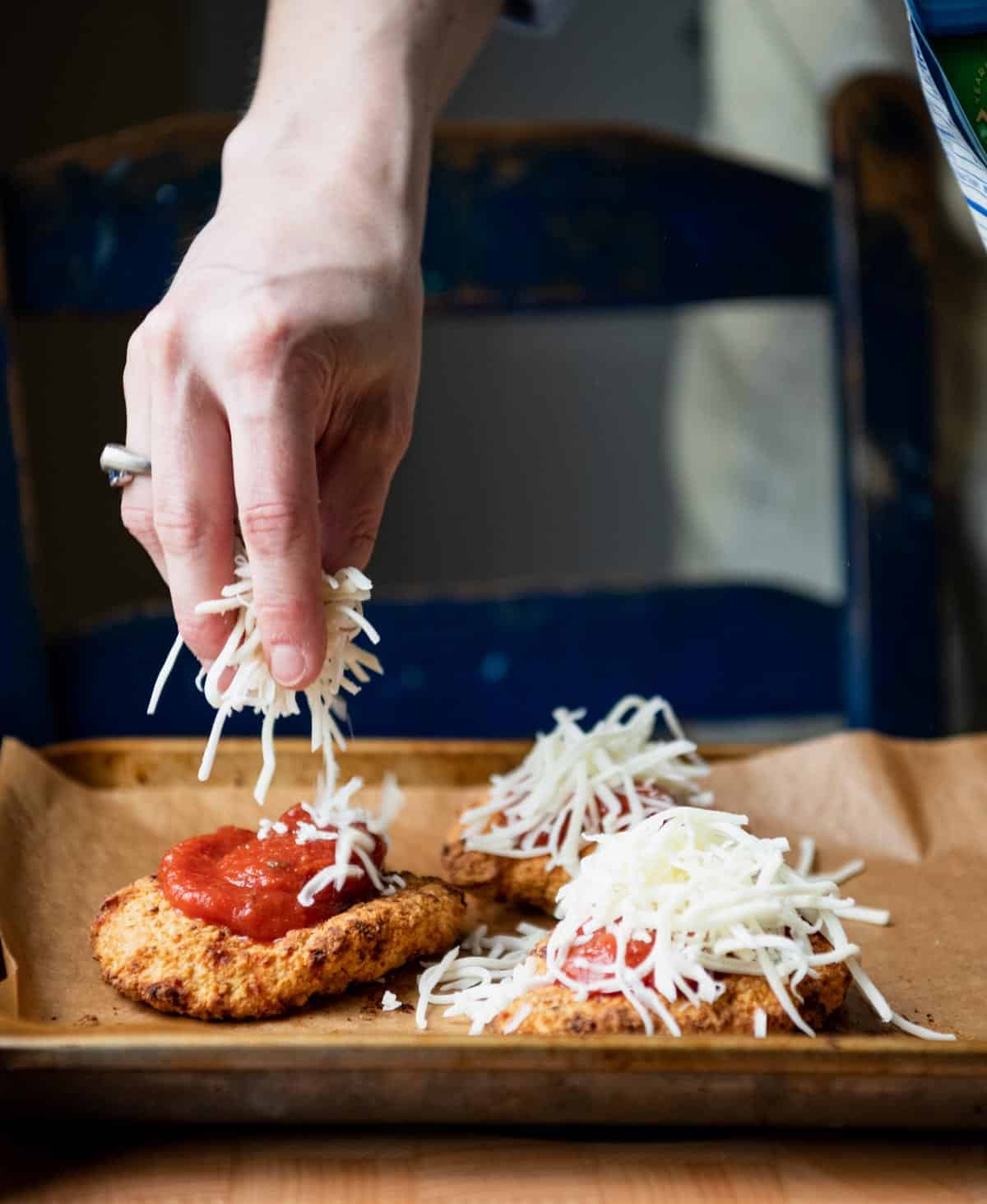 Process shot showing how to make chicken parmesan sandwich with frozen chicken patties.