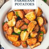 Crispy parmesan potatoes with text title overlay.