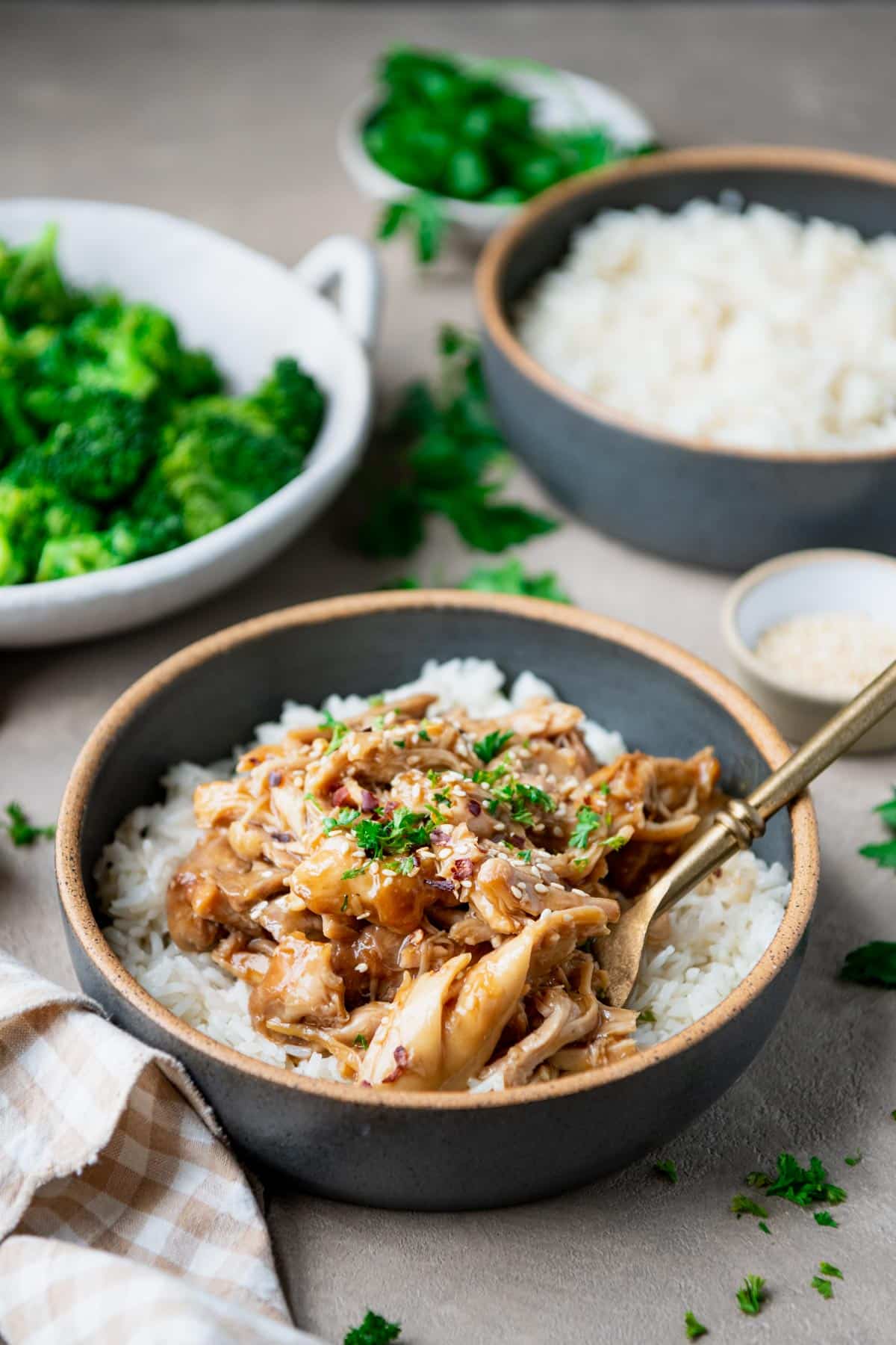 Crock pot shredded chicken with maple soy sauce over rice.