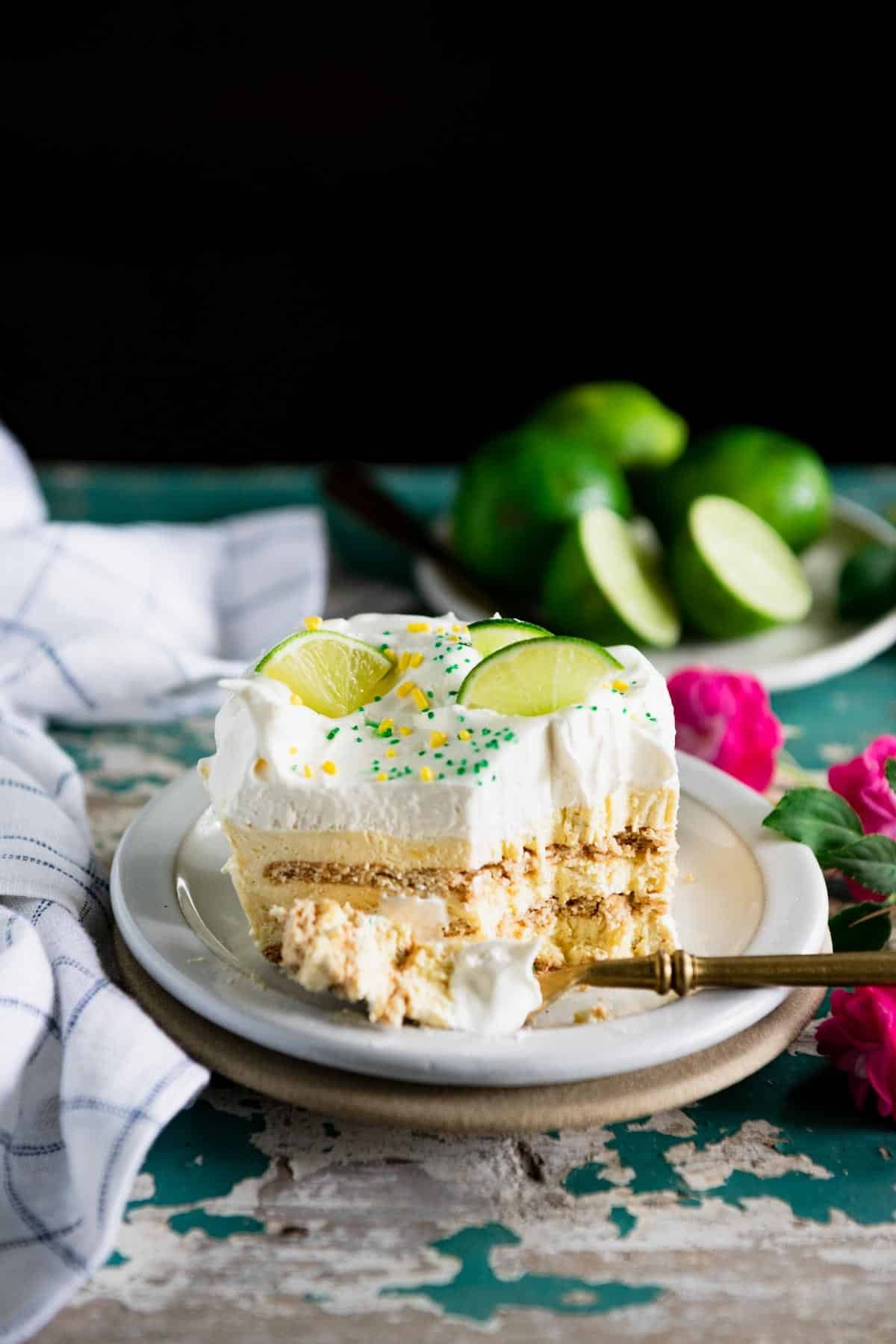 Slice of key lime icebox cake on a white plate.