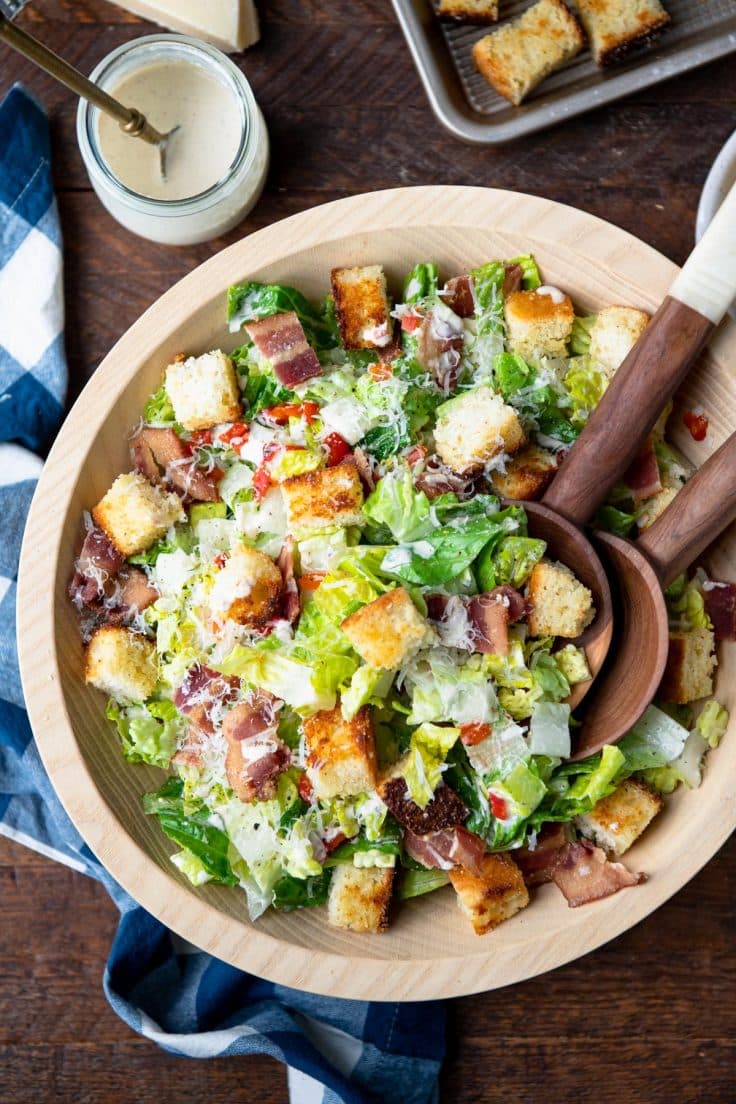 Overhead image of a Southern Caesar salad with creamy dressing.