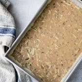 Zucchini cake batter in a baking dish before it goes in the oven.