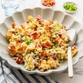 Horizontal side shot of a bowl of cornbread salad.