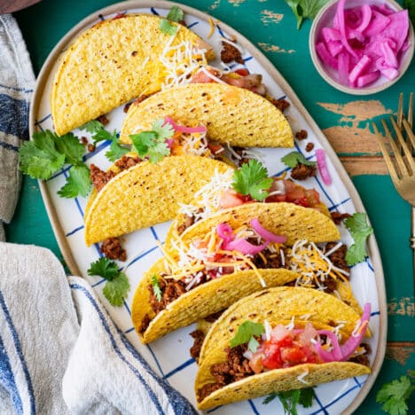 Square platter of ground beef tacos made with homemade taco seasoning for ground beef.
