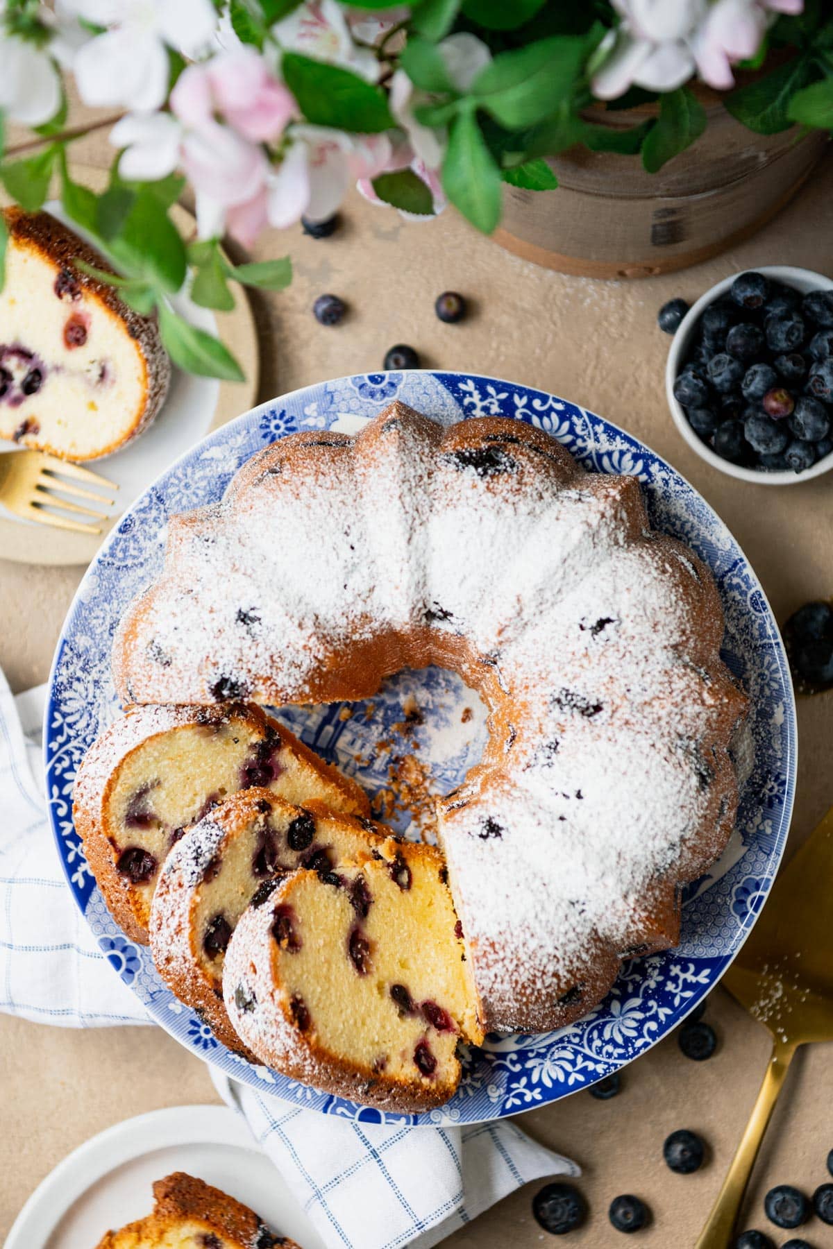 Overhead shot of blueberry pound cake on a cake stand.