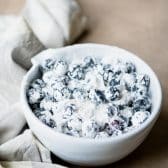 Bowl of fresh blueberries coated in flour.