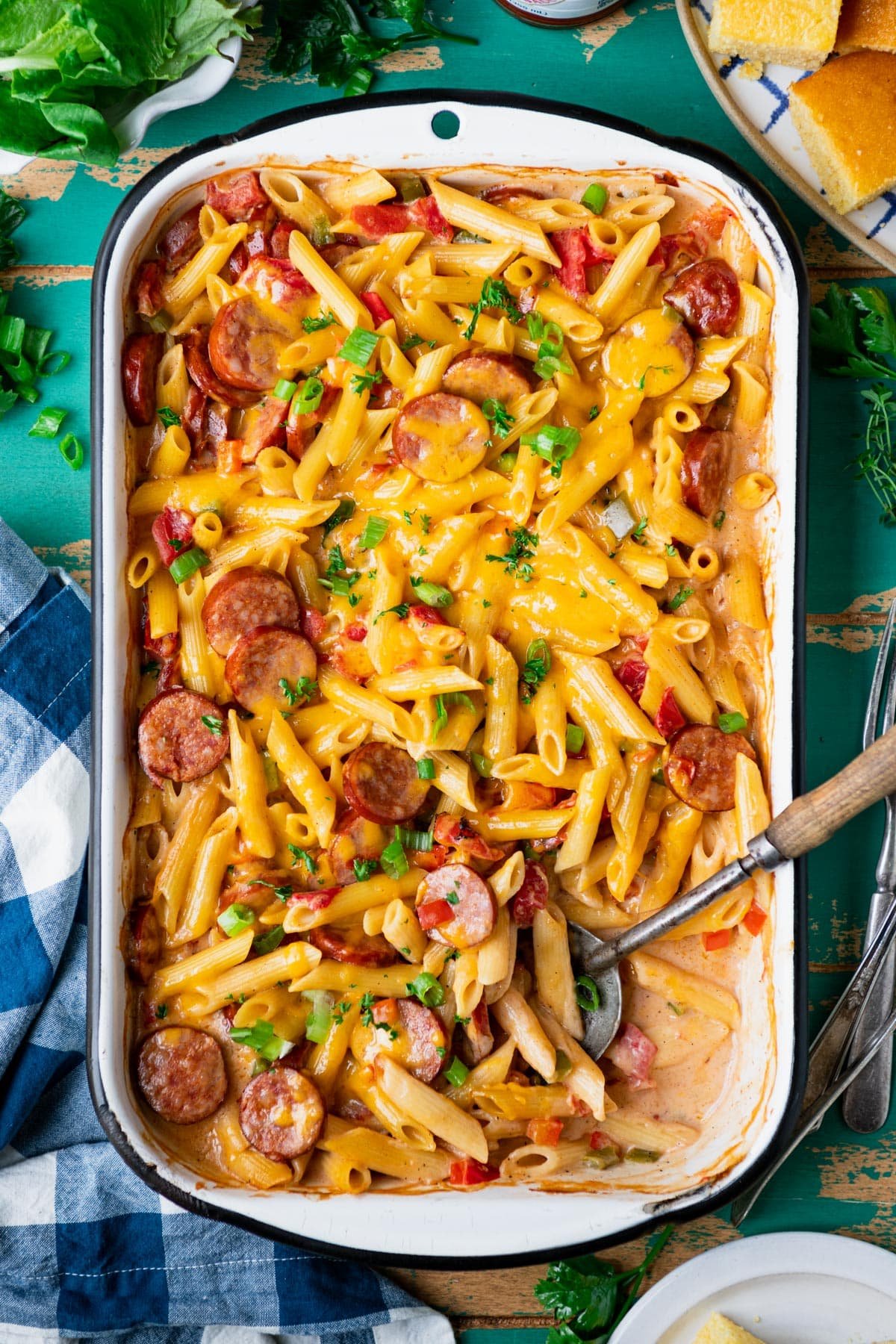 Overhead shot of a pan of cajun pasta with sausage and peppers in a casserole dish.