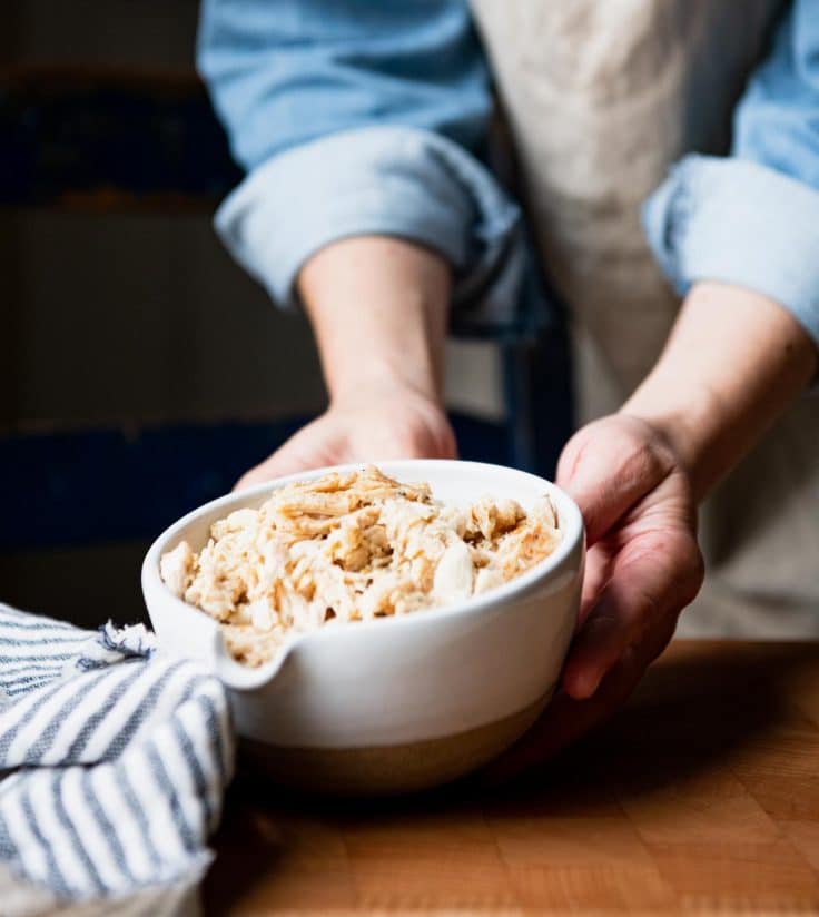 Bowl of shredded rotisserie chicken.
