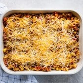 Horizontal overhead image showing how to make ground beef and corn casserole.