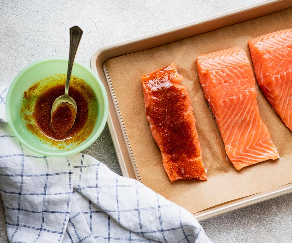 Process shot showing how to make old bay salmon.