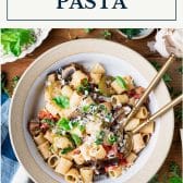 Bowl of roasted vegetable pasta with text title box at top.