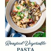 Bowl of roasted vegetable pasta with text title at the bottom.