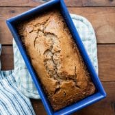 Baked applesauce spice cake in a blue pan.