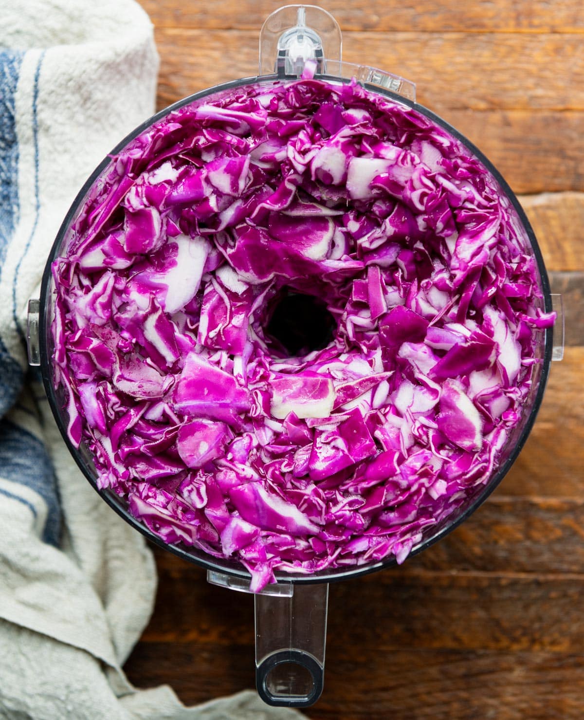 Sliced red cabbage in a food processor.