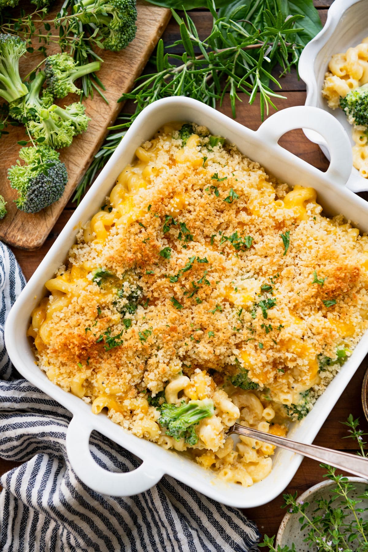Overhead pan of creamy baked mac and cheese with broccoli.